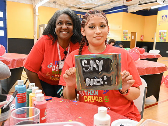  This is a photo of a student working on a Red Ribbon Week activity